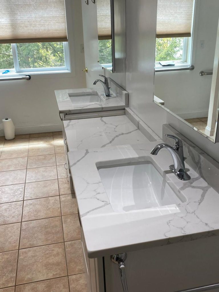 Luxury kitchen with custom stone countertops and a polished island