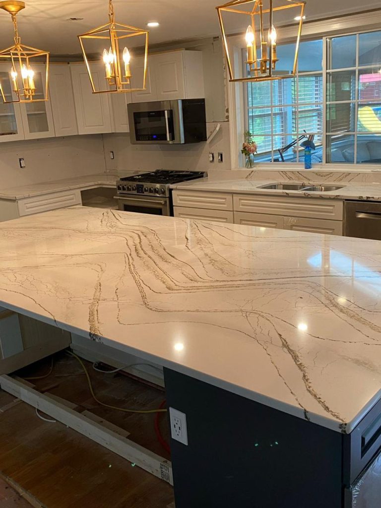 Marble countertop and backsplash details in an elegant kitchen