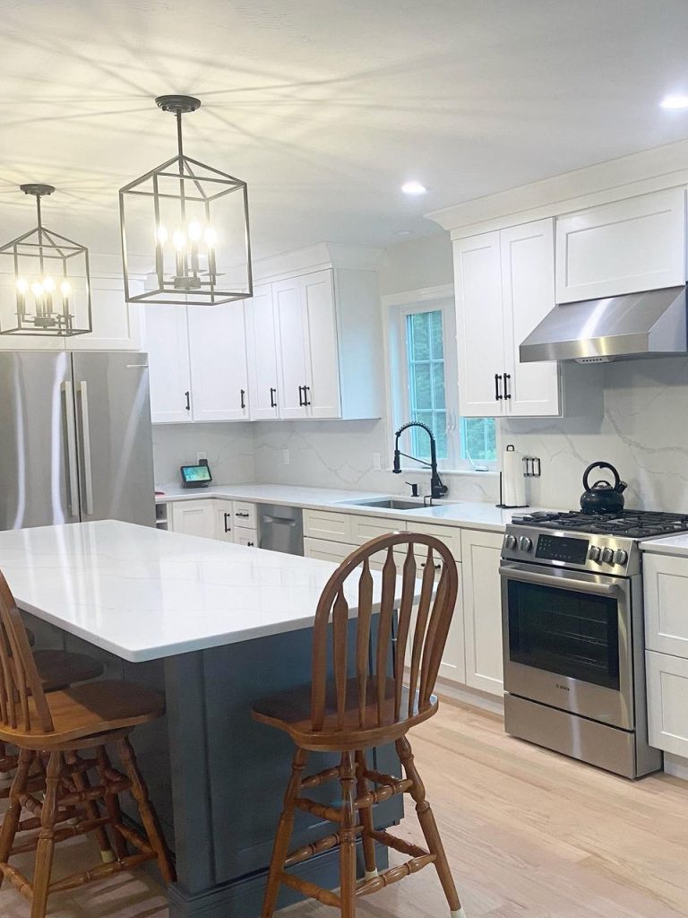 Modern kitchen featuring a bright quartz countertop and island